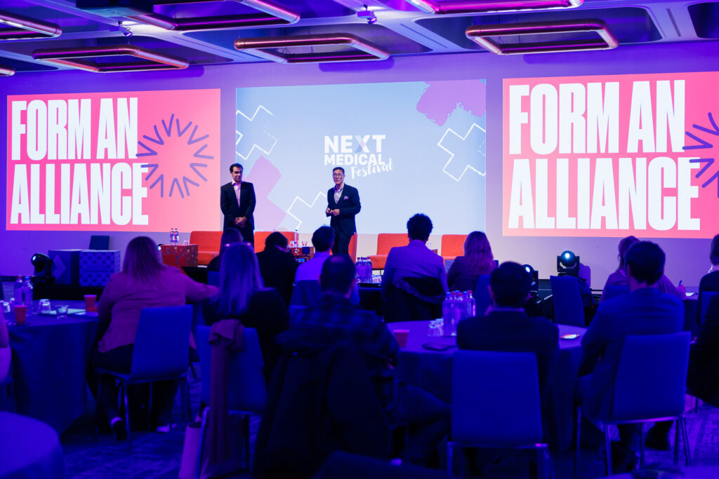 Vernon and Kishan talking to an audience at Next Medical Festival