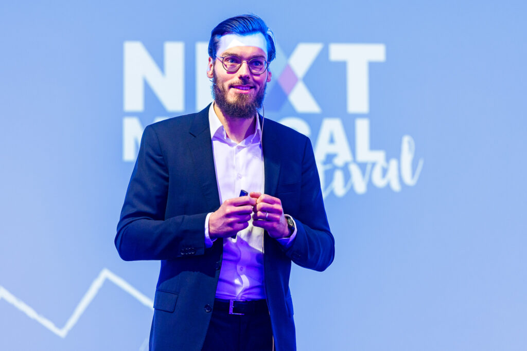 Thomas Lanz on a stage at the Next Medical Festival