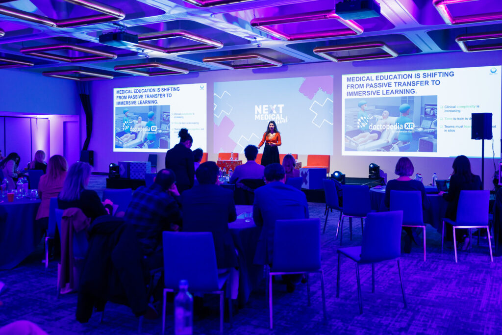 Charlotte Hubault talking to an audience at Next Medical Festival