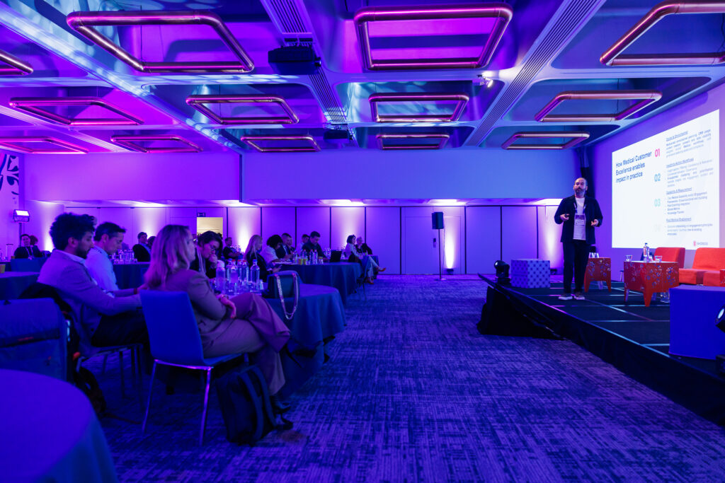 Bekir Ozer speaking to an audience at Next Medical Festival