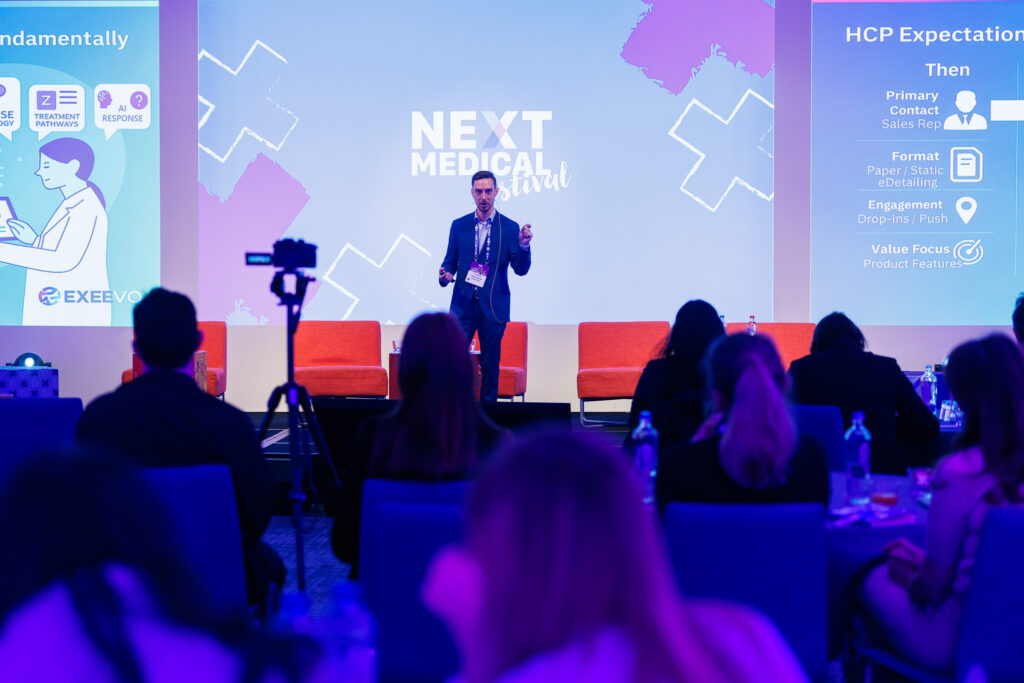 Sam Rolfe speaking to an audience at Next Medical Festival