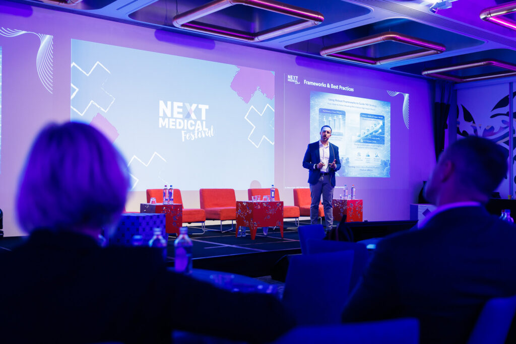 Mussa Arvani speaking to an audience at Next Medical Festival